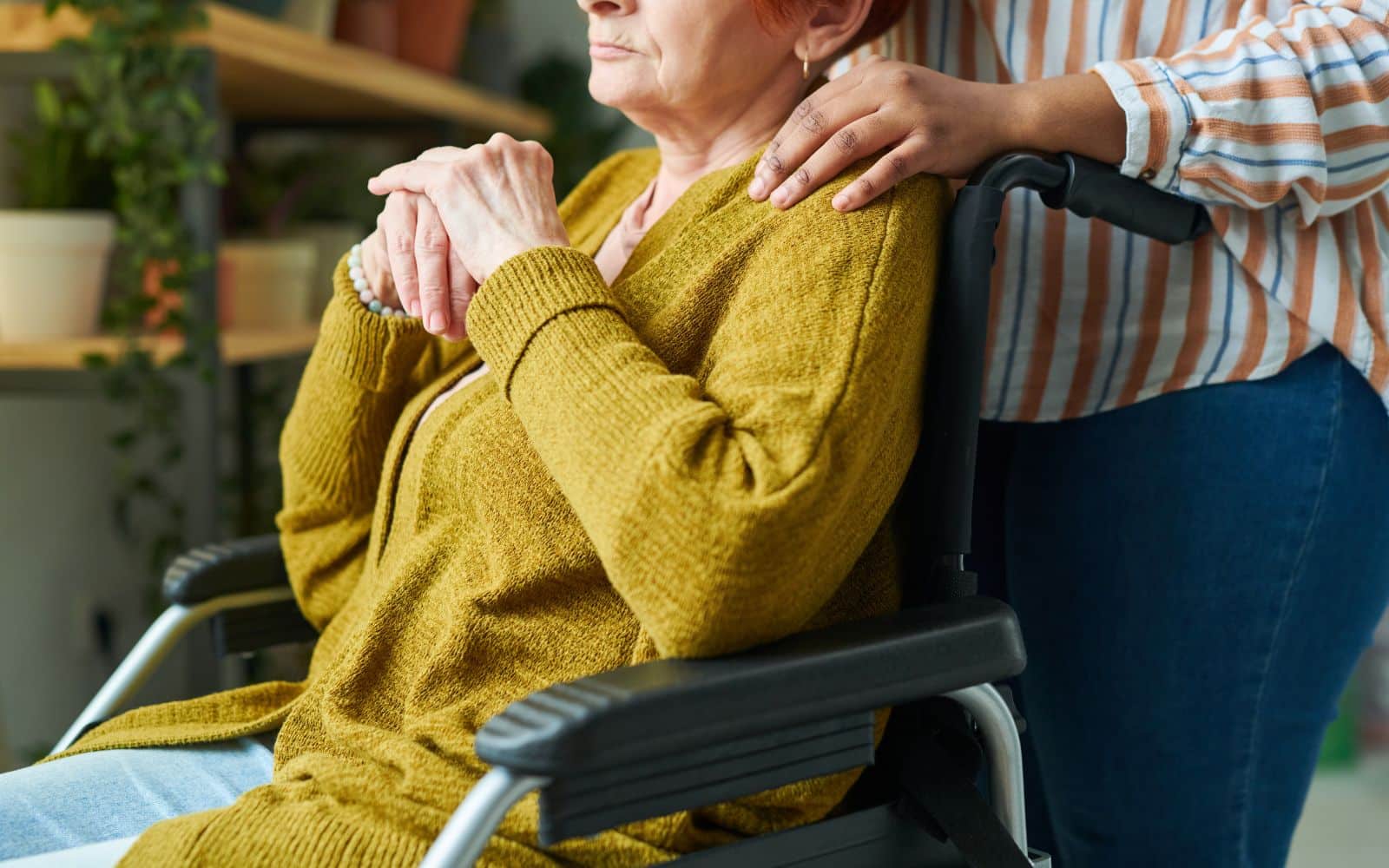 elder sitting in wheelchair with serious expression