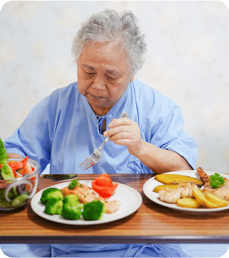 Asian senior or elderly old lady woman patient eating breakfast