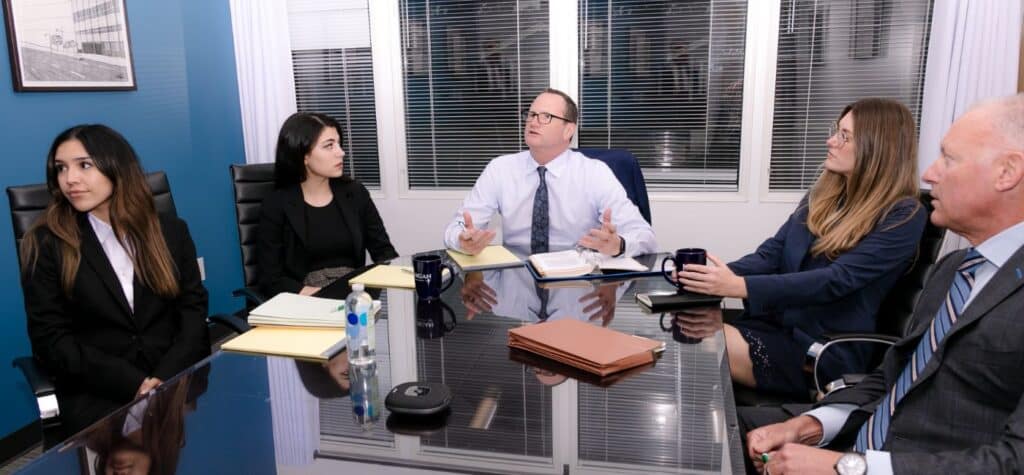 Lanzone Morgan attorneys at a round table session discussing a case