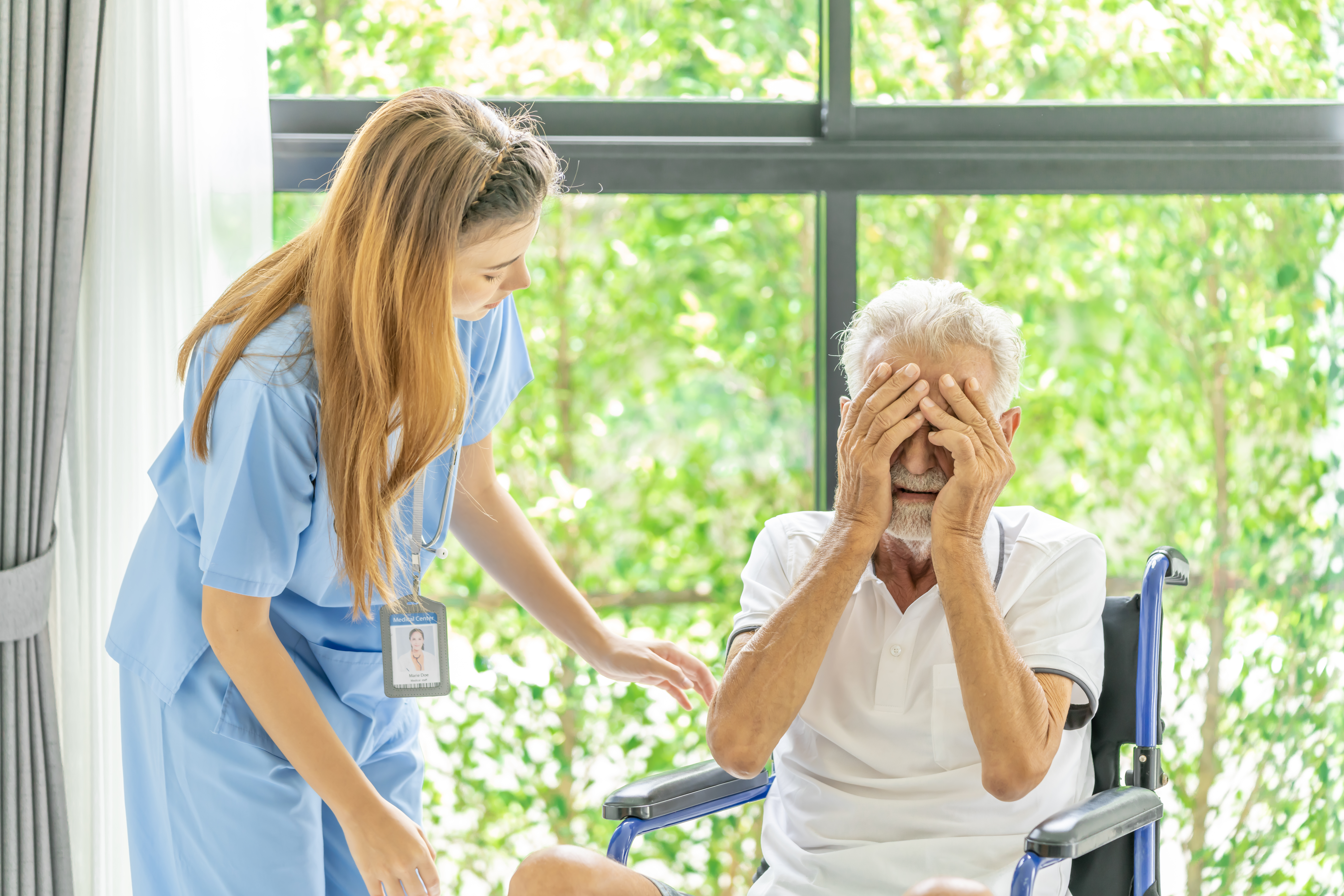 Elderly man being abused by a female nursing home staff.